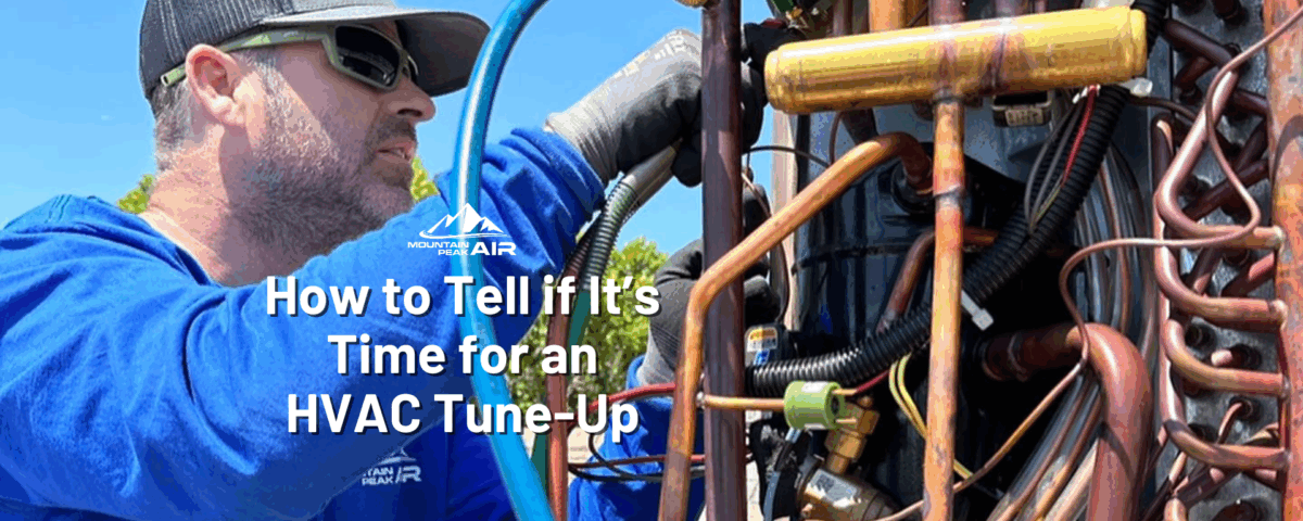 Mountain Peak Air technician works on HVAC unit