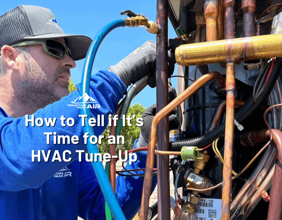 Mountain Peak Air technician works on HVAC unit